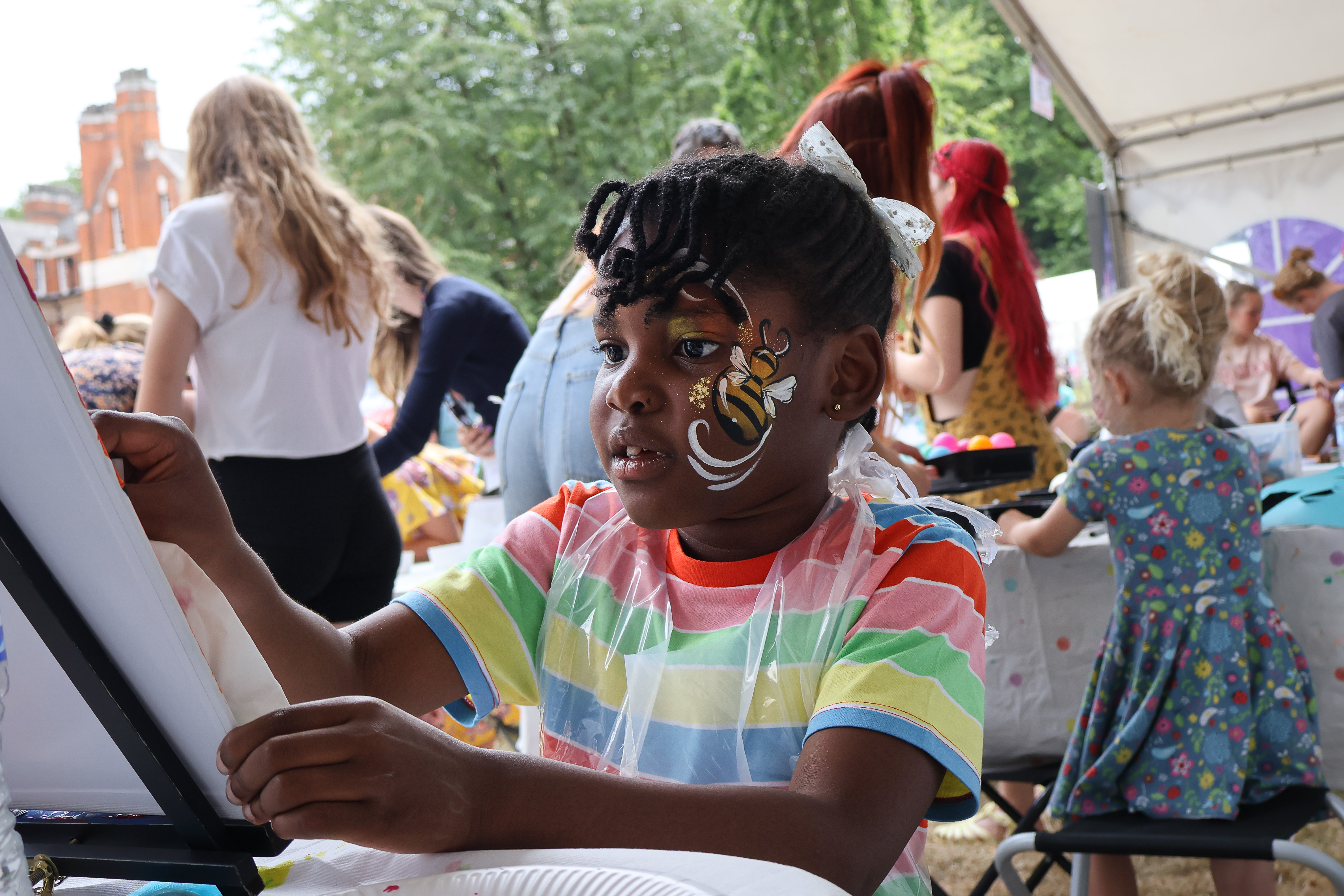 Children face painting at the Sticks N Stones Festival in Medway Kent