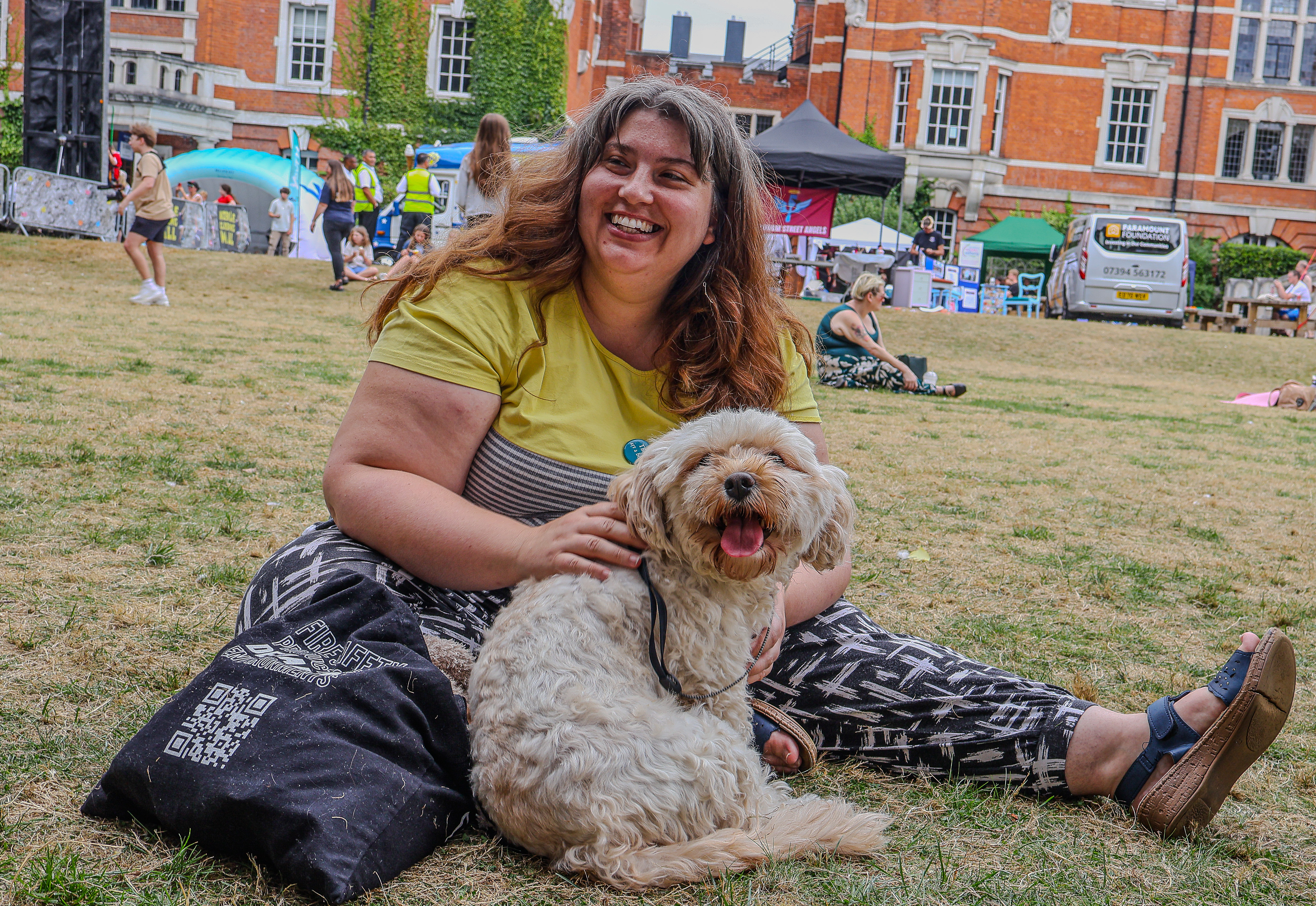 Lady picnicking with a dog at the Sticks N Stones Festival in Medway Kent