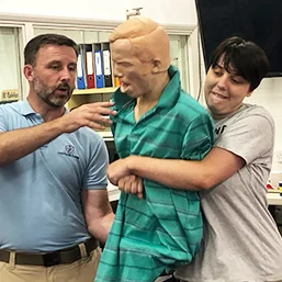 young person learning First Aid Training