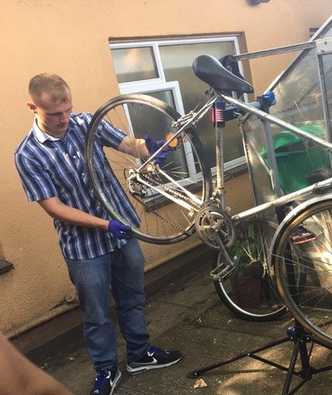 Volunteer fixing a bicycle Medway